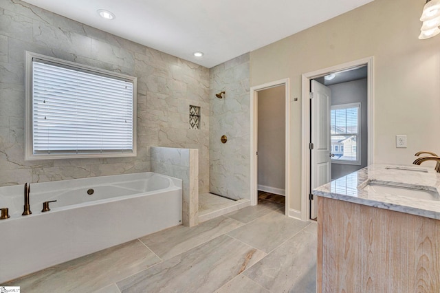 bathroom with vanity and plus walk in shower