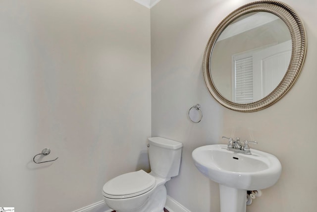 bathroom with sink and toilet