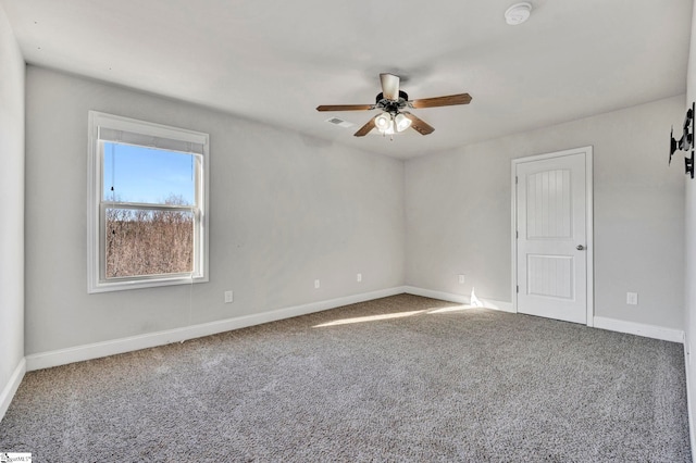 empty room with carpet floors and ceiling fan