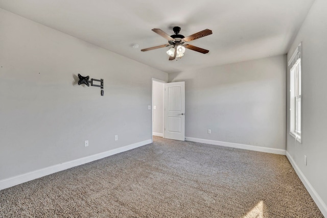 carpeted empty room with ceiling fan