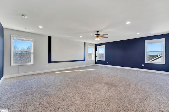 home theater with ceiling fan and carpet