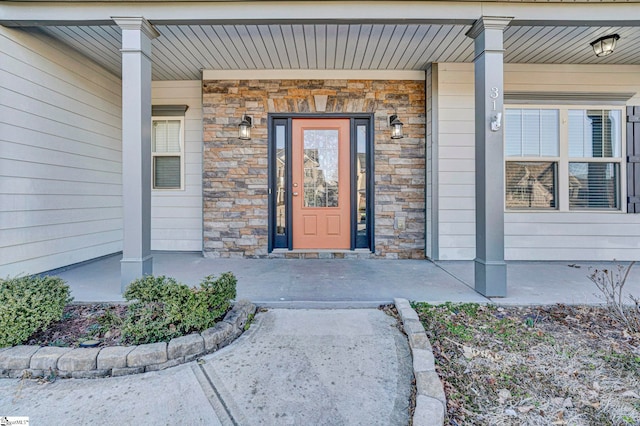 doorway to property featuring a porch