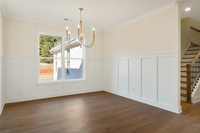 unfurnished dining area with a notable chandelier, crown molding, and dark hardwood / wood-style floors