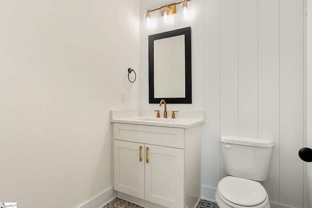 bathroom with toilet and vanity