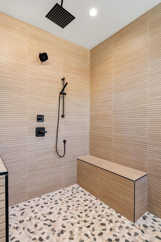 bathroom with tiled shower