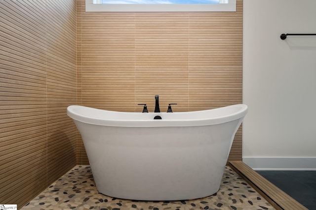 bathroom featuring a bathtub and tile patterned floors