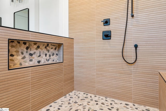 bathroom with tiled shower