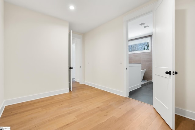 unfurnished bedroom with hardwood / wood-style flooring