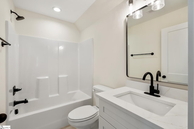 full bathroom featuring toilet, vanity, and bathtub / shower combination