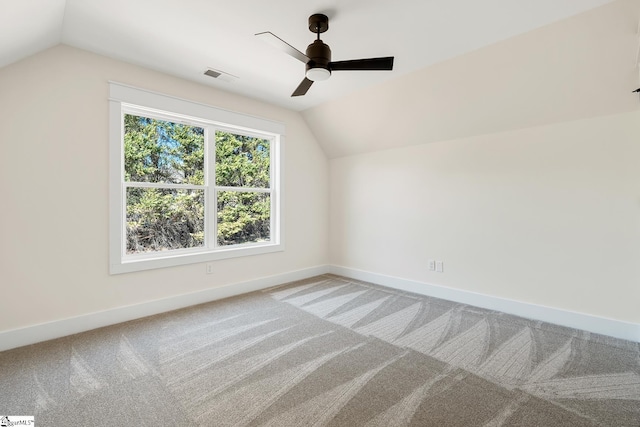 additional living space featuring lofted ceiling, ceiling fan, and carpet