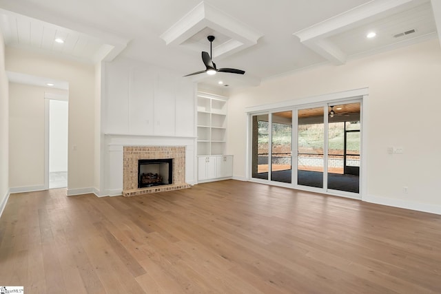 unfurnished living room with ceiling fan, beam ceiling, and light hardwood / wood-style flooring