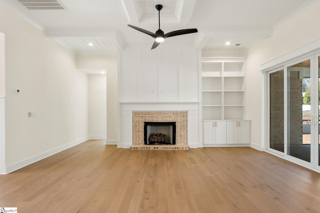 unfurnished living room featuring ceiling fan, beamed ceiling, ornamental molding, and light hardwood / wood-style floors