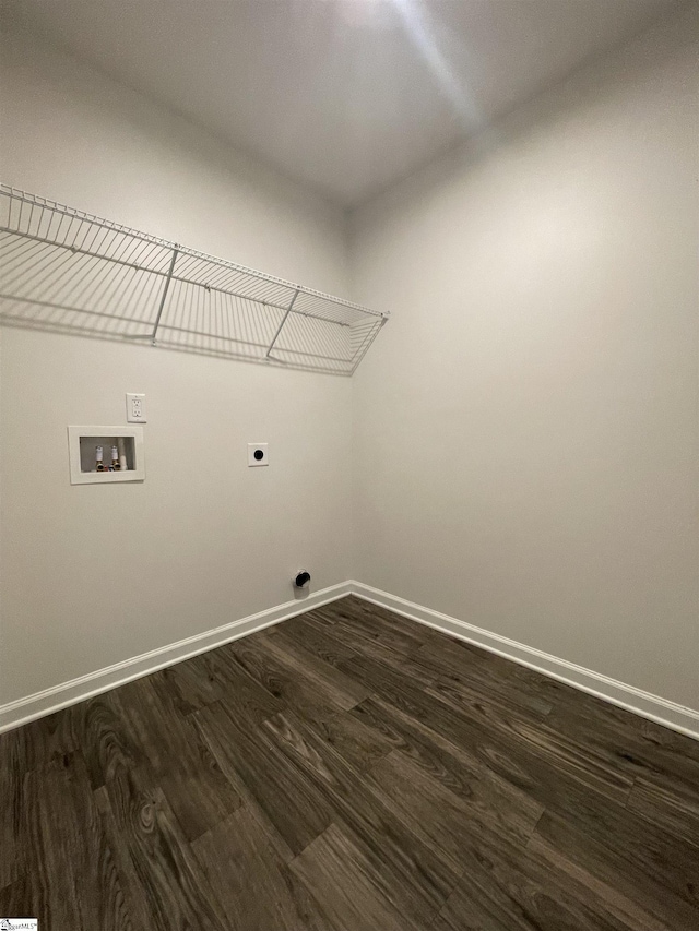 washroom featuring dark hardwood / wood-style floors, washer hookup, and electric dryer hookup