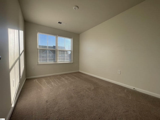 empty room featuring carpet flooring