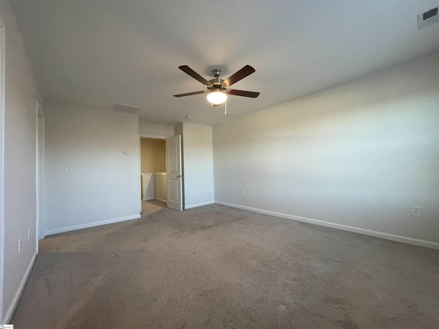 carpeted empty room featuring ceiling fan