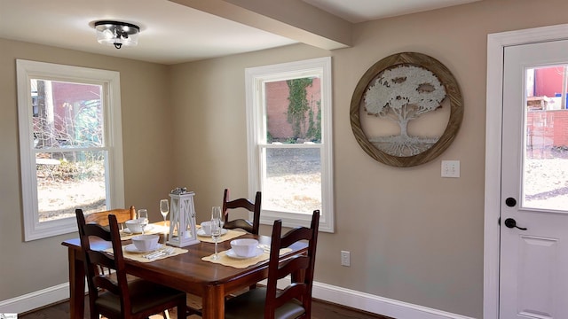 dining space with dark wood-type flooring