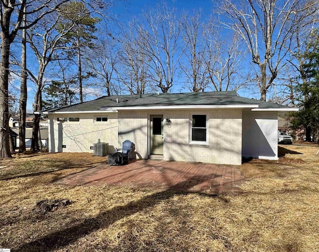 rear view of property with a patio area and central air condition unit