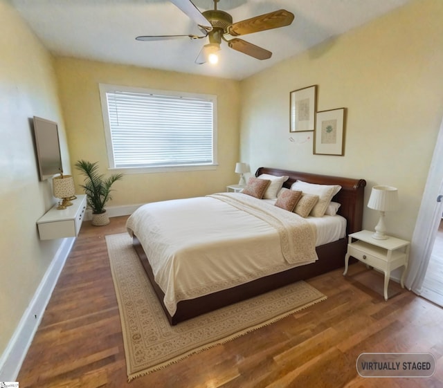 bedroom featuring ceiling fan and dark hardwood / wood-style flooring