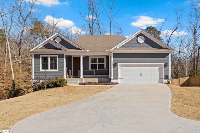 view of front of house with covered porch and a garage