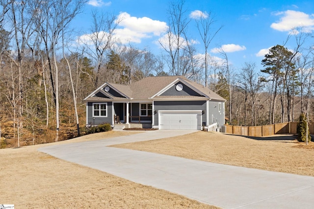 craftsman-style home featuring a garage and a front lawn