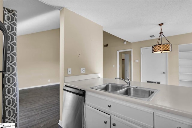 kitchen with decorative light fixtures, sink, white cabinetry, and dishwashing machine