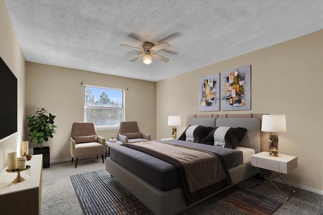 bedroom featuring ceiling fan, light colored carpet, and a textured ceiling