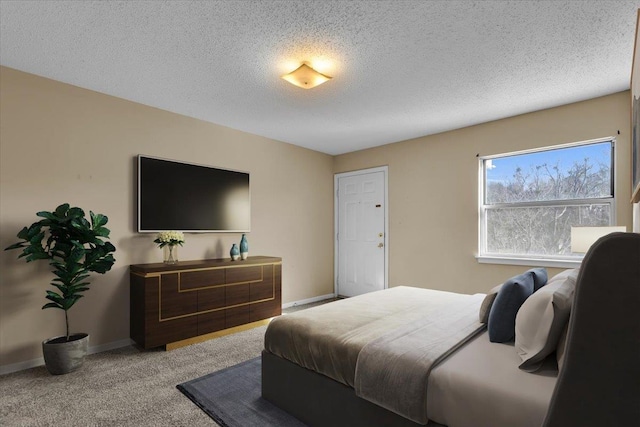 carpeted bedroom with a textured ceiling