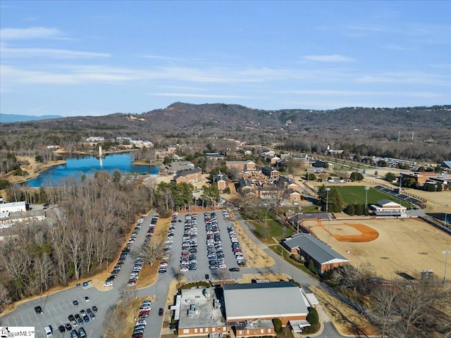 bird's eye view with a water and mountain view