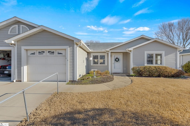 ranch-style home featuring a front yard and a garage