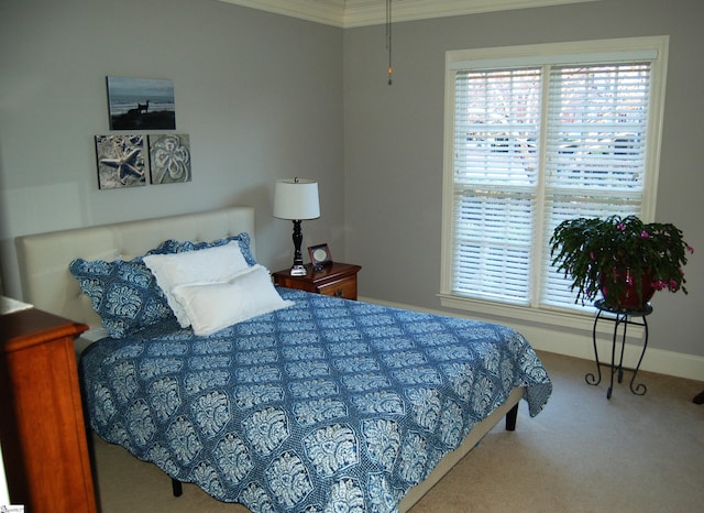 carpeted bedroom featuring crown molding