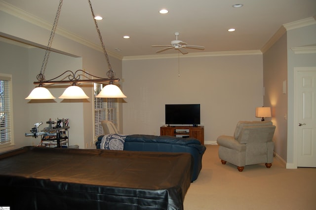 rec room featuring carpet, ceiling fan, and crown molding