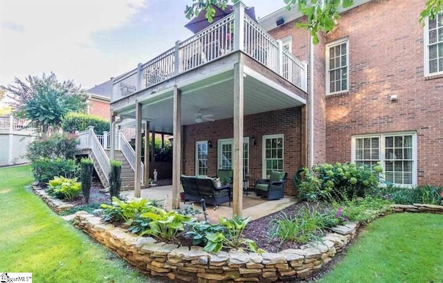 rear view of property featuring a yard, an outdoor hangout area, and a patio