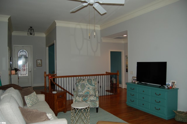 living room with ceiling fan, dark hardwood / wood-style floors, and crown molding