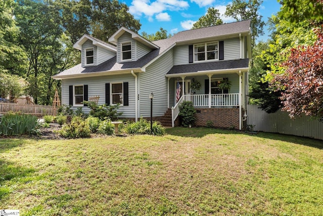 view of front facade with covered porch and a front lawn