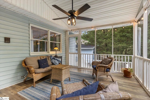 sunroom / solarium featuring ceiling fan