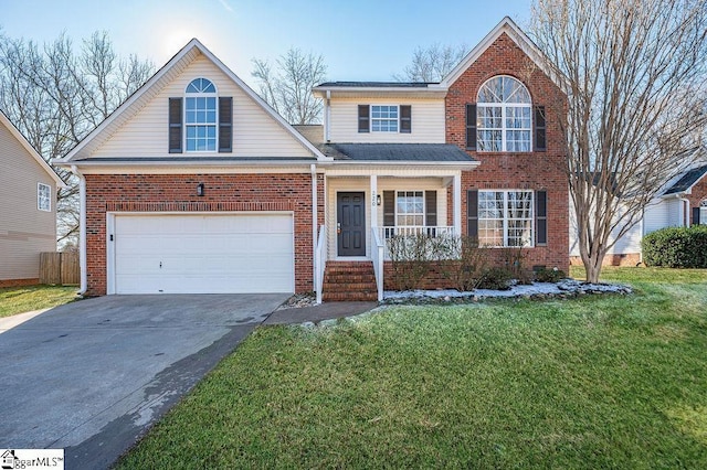 view of front property featuring a garage, a front lawn, and covered porch