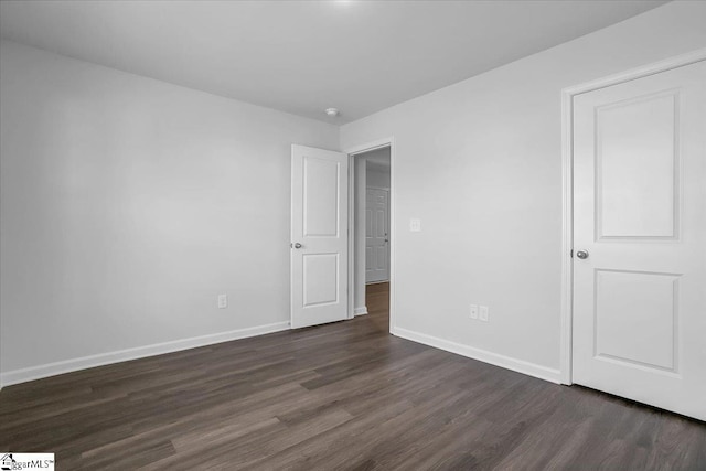 empty room featuring dark hardwood / wood-style floors