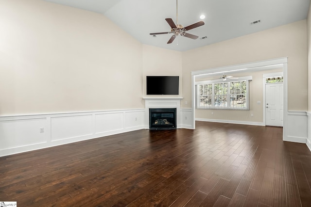 unfurnished living room featuring vaulted ceiling, ceiling fan, and dark hardwood / wood-style floors