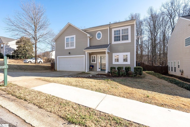 front facade with a garage and a front yard