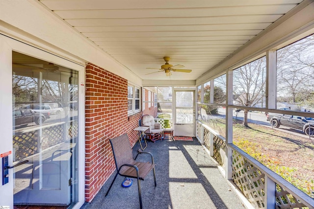 sunroom featuring ceiling fan