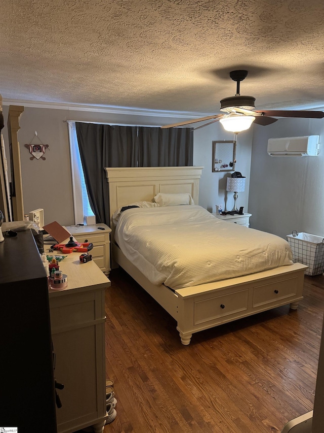 bedroom with ceiling fan, an AC wall unit, dark hardwood / wood-style flooring, and a textured ceiling