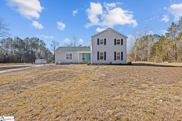 view of front facade featuring a front yard and a porch