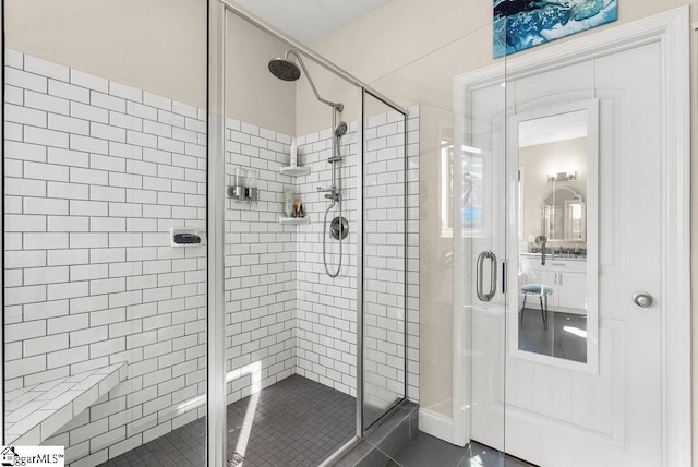 bathroom featuring tile patterned flooring and an enclosed shower