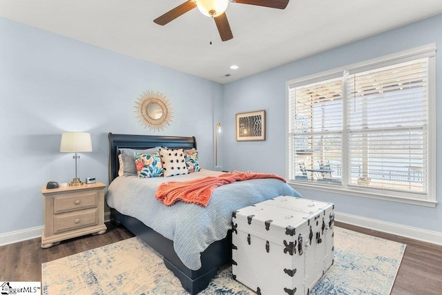 bedroom featuring ceiling fan and dark hardwood / wood-style floors