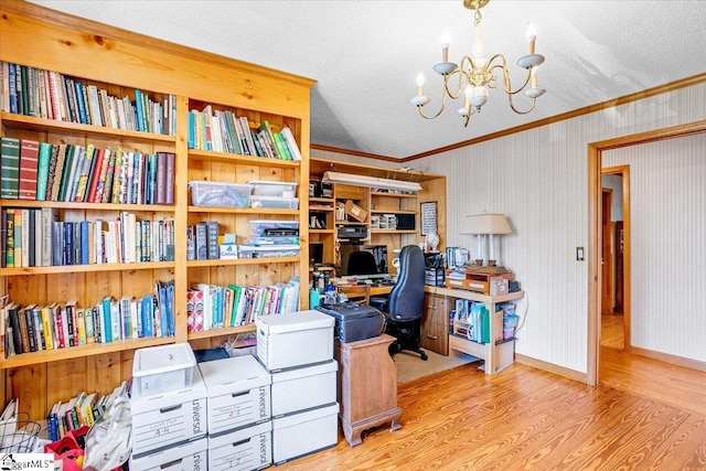 office area featuring a notable chandelier, crown molding, a textured ceiling, and wood finished floors