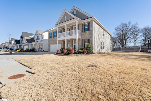 view of front of home featuring a balcony and a garage