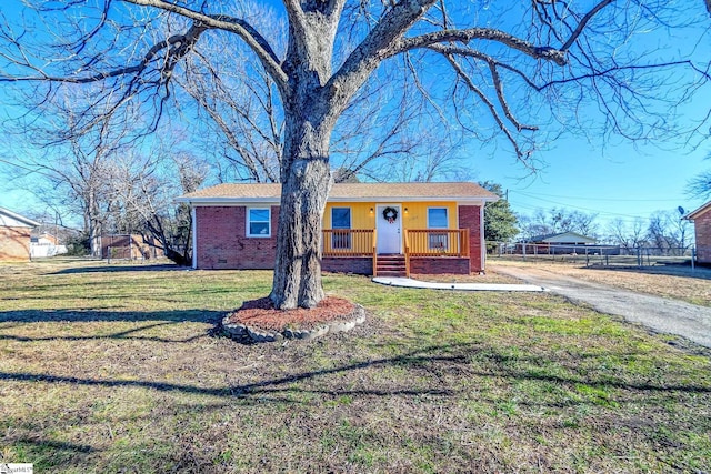 ranch-style house with a front yard