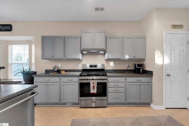 kitchen featuring gray cabinetry and stainless steel gas stove