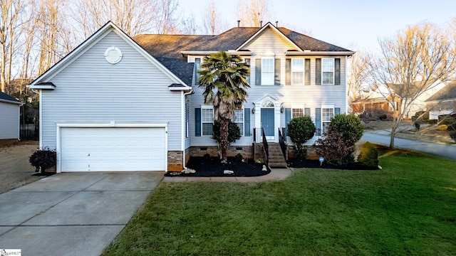 view of front of home with a garage and a front yard