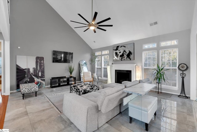 living room with high vaulted ceiling, ceiling fan, and plenty of natural light